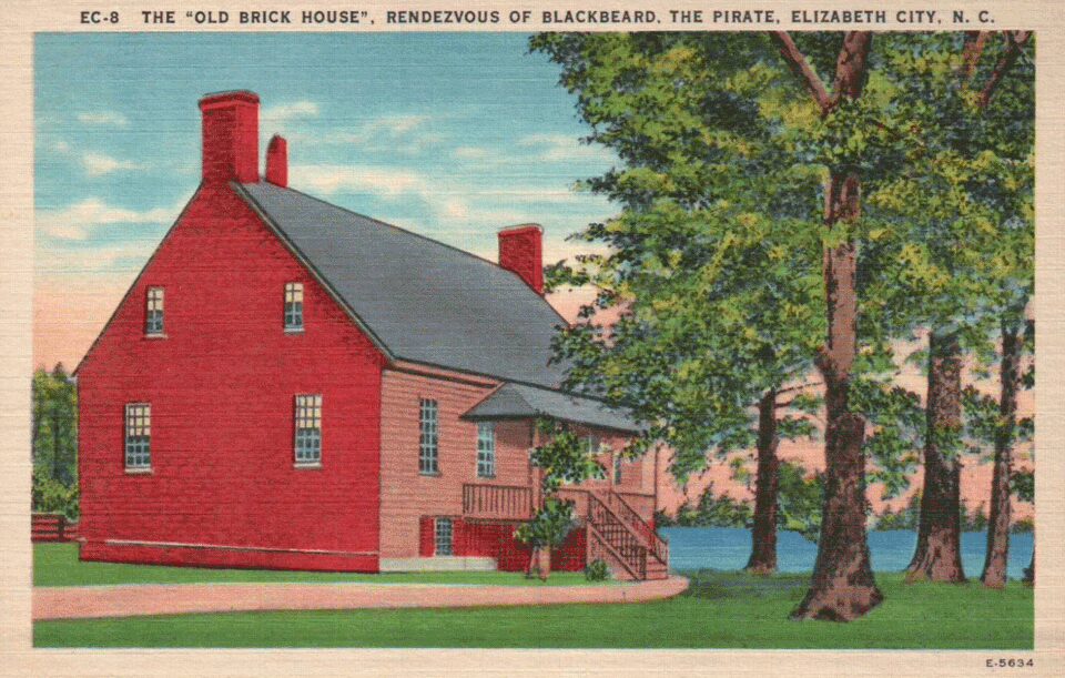 A vintage postcard of The Old Brick House in Elizabeth city. One of the oldest surviving brick residences in North Carolina. Legend has it that the house was built by Edward Teach, although records suggest it wasn't constructed until several decades after his death.